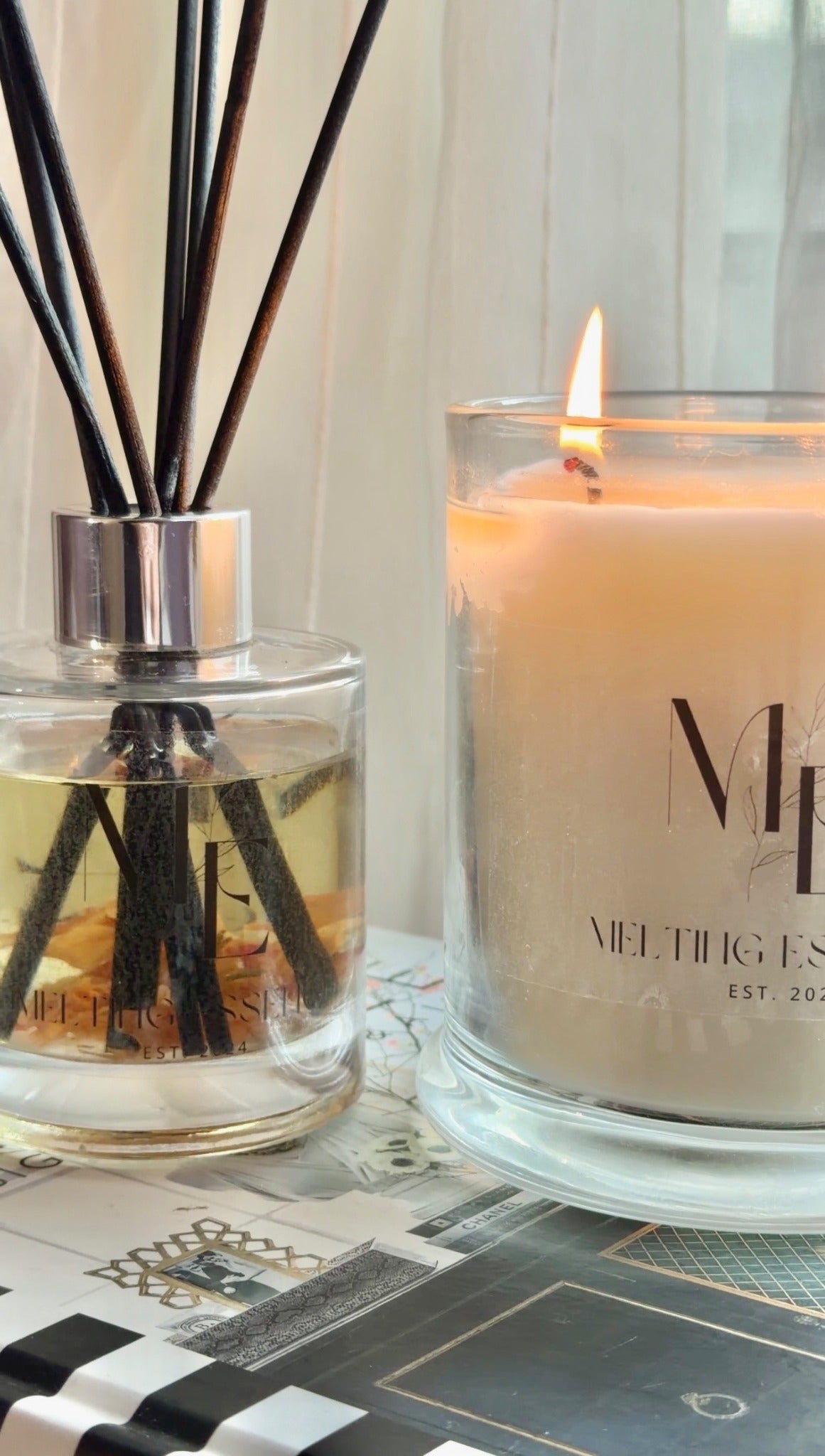 Melting Essence candle with reed diffuser styled photograph